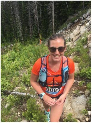 Steph wears her Ultimate Direction Adventure Vesta vest in a 50k race in Canada